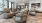 recessed lighting in spacious lounge with tables and chairs