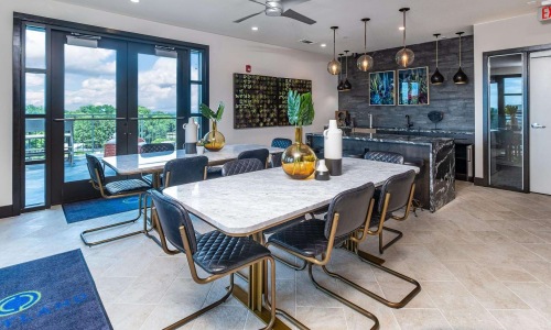 clubhouse kitchen and dining room with tables and chairs